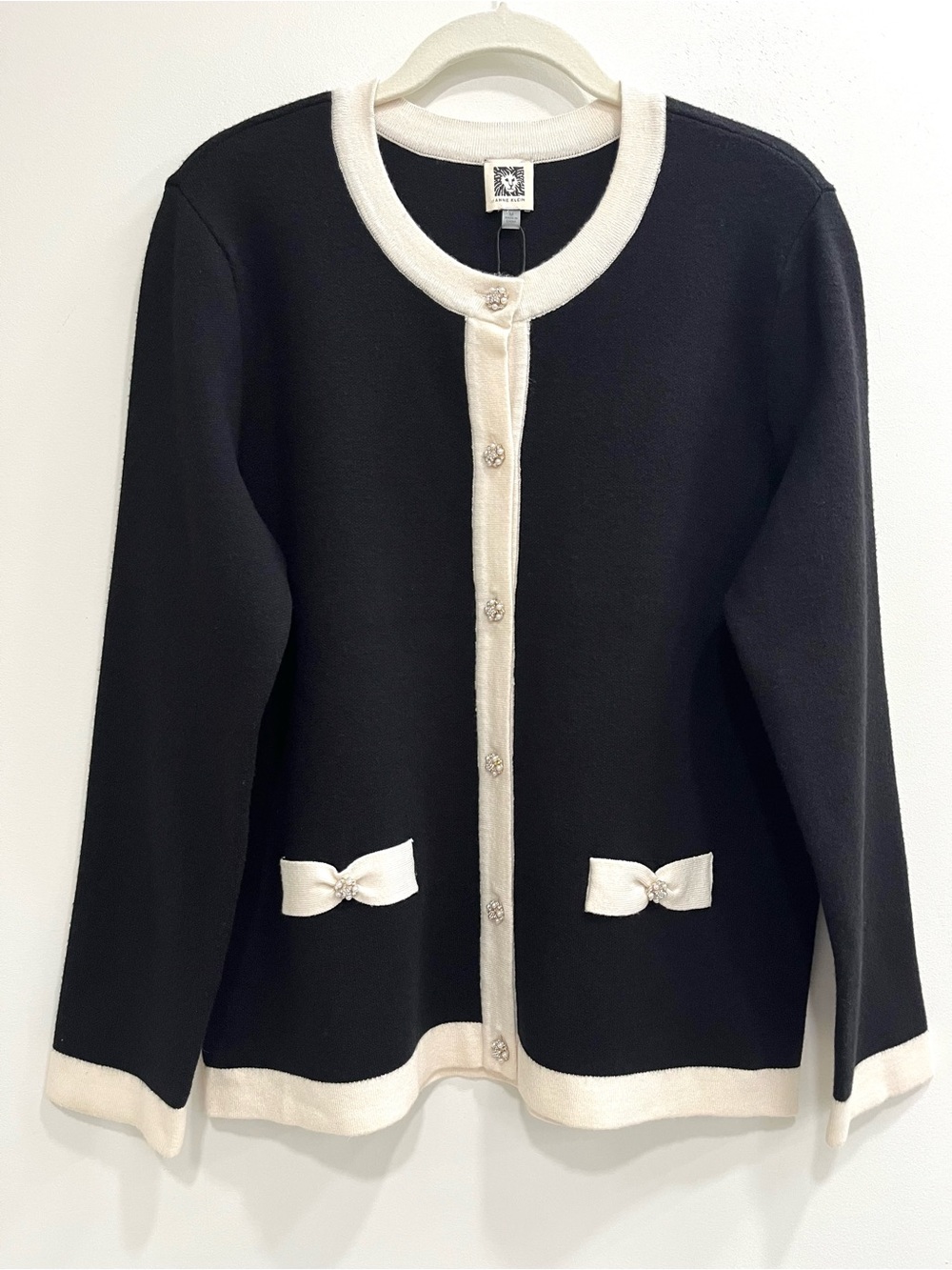 Anne Klein black cardigan cream trim decorative pearl buttons bow pockets medium
